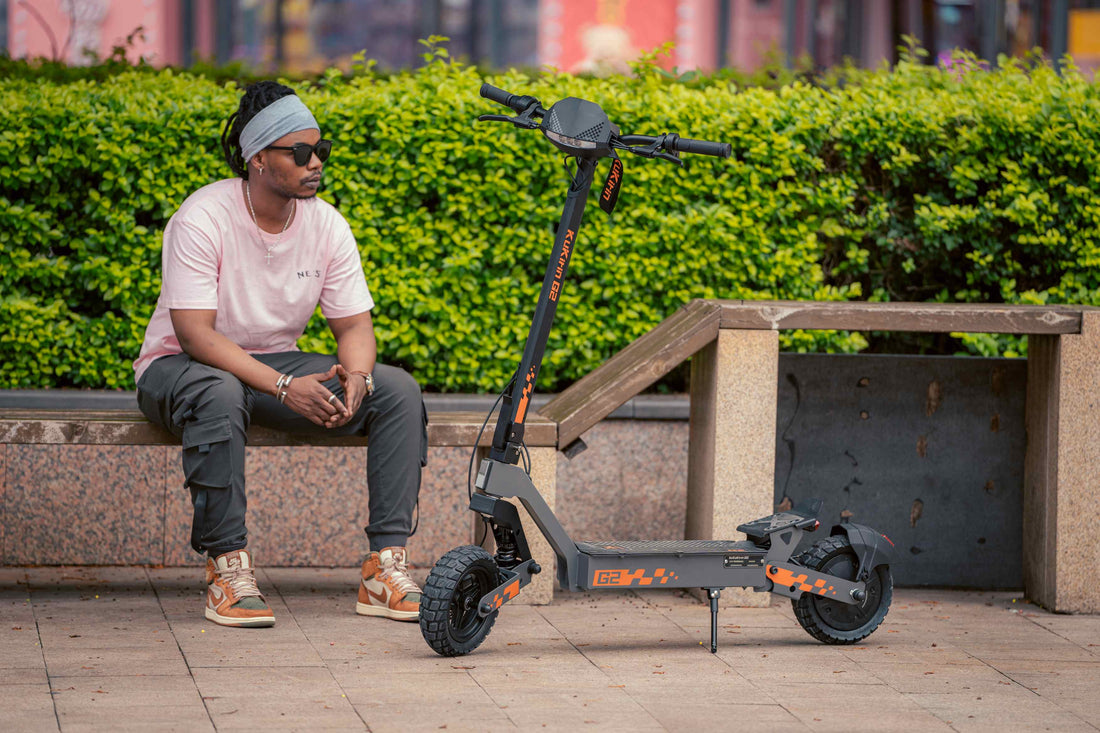 Sleek foldable Kukirin G2 electric scooter: high-performance adult e-scooter with rugged off-road tires, showcased in a stylish outdoor urban setting