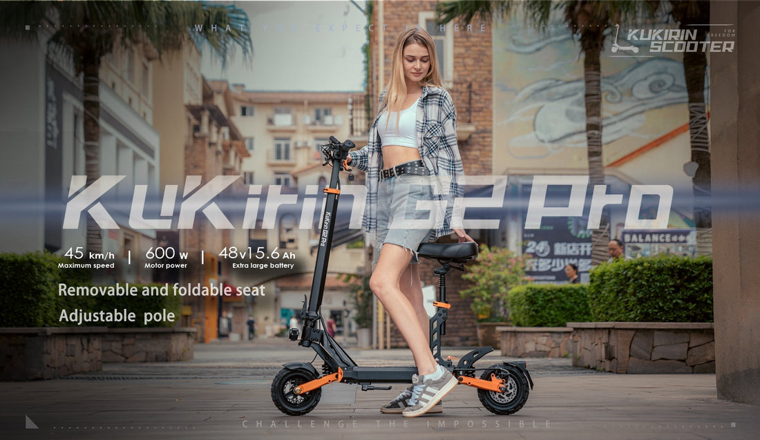 KuKirin G2 Pro electric scooter: A woman stands next to the scooter (black and orange design) with key features labeled: 45 km/h speed, 500W power, 48V 15.6Ah battery, removable foldable seat, and adjustable pole.